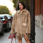 paris, france   september 29 tiffany hsu is seen wearing a tan acne coat, tan and white tip boots and acne bag outside the acne show during paris fashion week ss 2022 on september 29, 2021 in paris, france photo by daniel zuchnikgetty images
