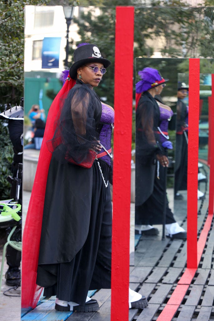 a cosplayer dressed as dr facilier from princess and the frog poses