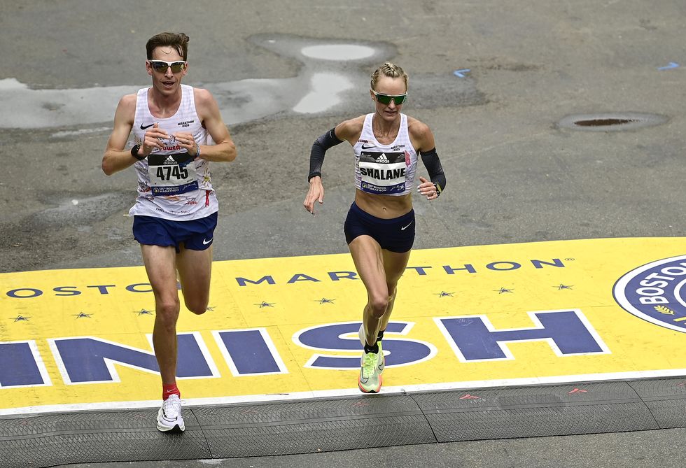 boston, massachusetts   october 11 shalane flanagan of the united states crosses the finish line during the 125th boston marathon on october 11, 2021