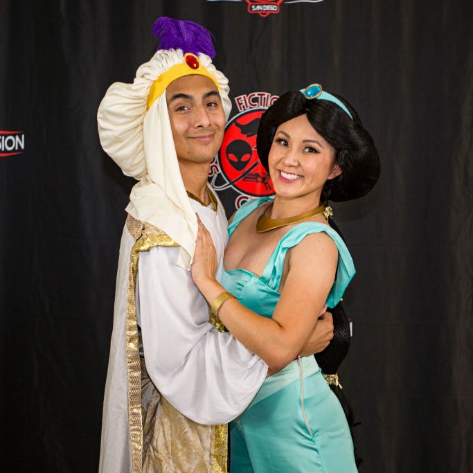 cosplayers noah aguilar as aladdin l and irene yu as princess jasmine from aladdin attend fandom invasion at california center for the arts, escondido