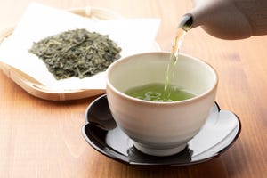 warm green tea poured into a cup