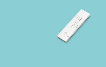 positive rapid sars cov 2 covid 19 antigen test on a blue background