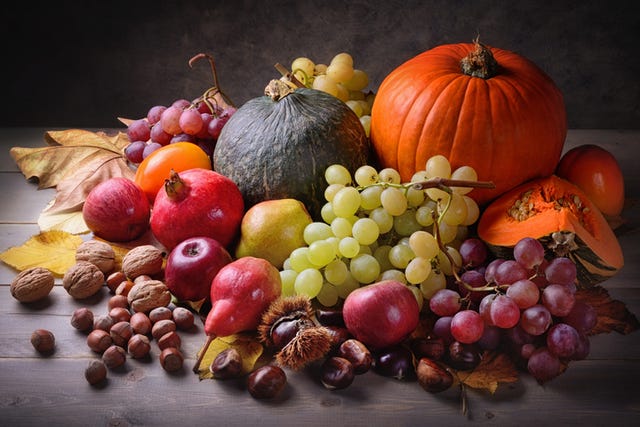 autumn fruits on wooden table, close up