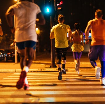 Run towards your goals back shot of a group of unrecognizable people running together in the city streets