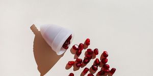 pomegranate seeds pour out of the menstrual cup