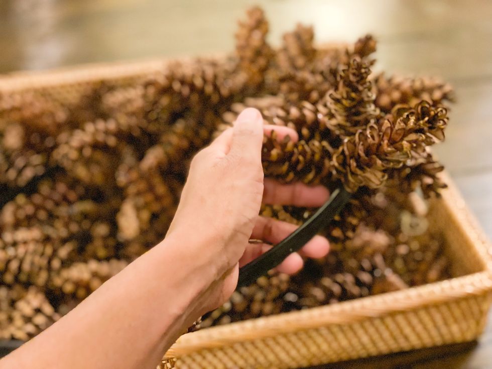 wreath making with fresh pine cones