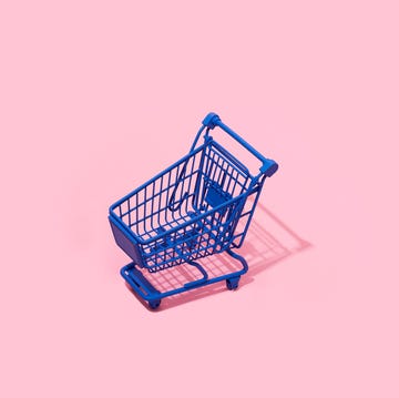 blue shopping cart an empty blue shopping cart on a pink background with some blank space around it
