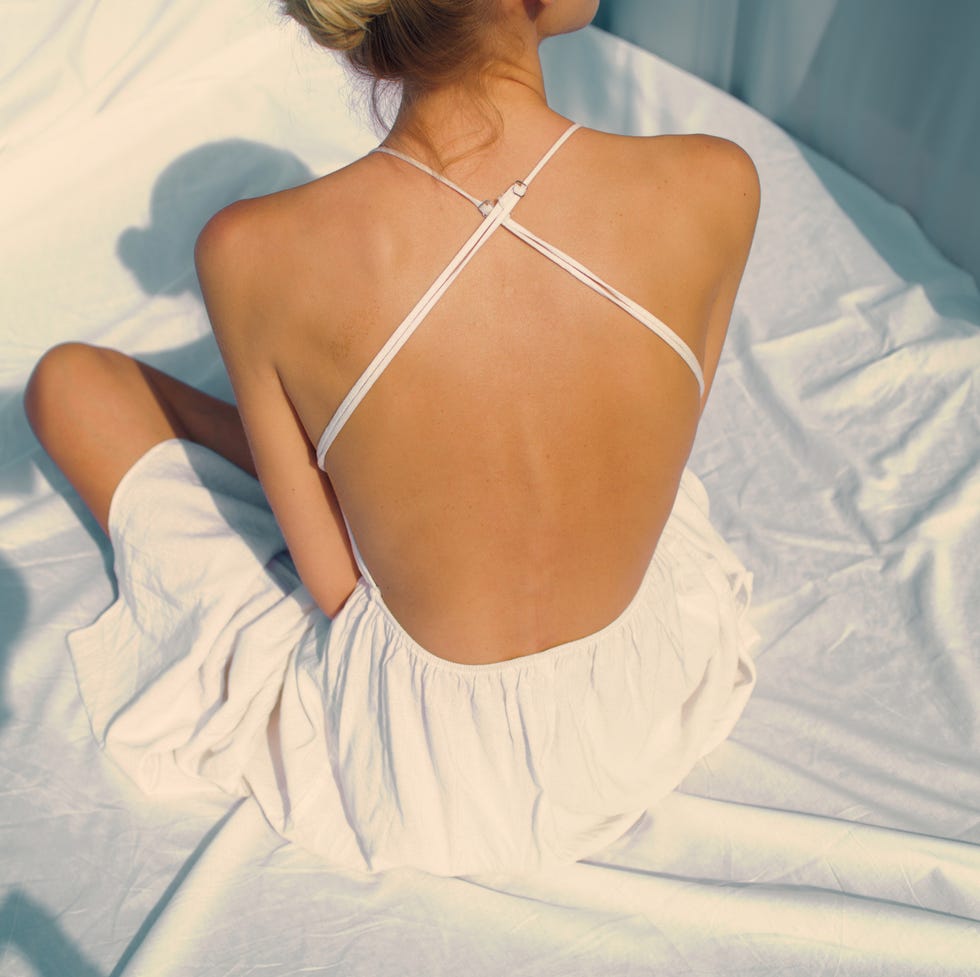 Brand new pictures for my profile. Woman posing in seductive dress with naked back seductive woman in elegant dress posing for a photo. naked back with shadows
