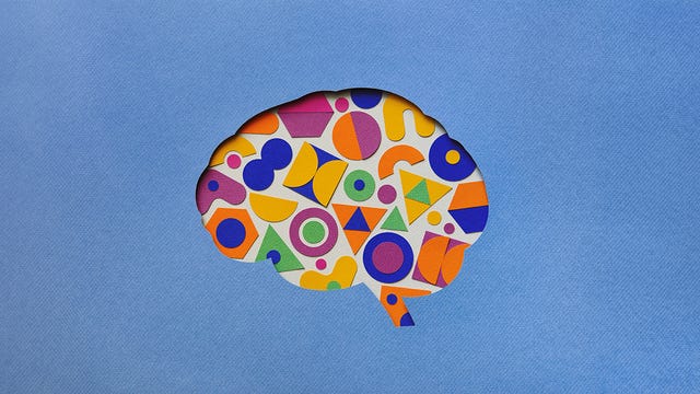 colorful geometric patterns within a brain silhouette against a blue background