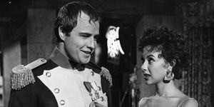 Marlon Brando and Rita Moreno visit on the set of the film 'Desiree.'