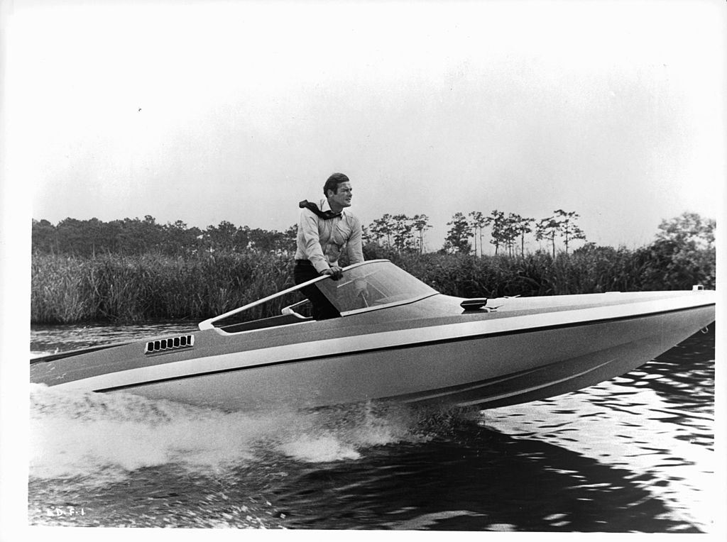 roger moore at the wheel of a speed boat in a scene from the film live and let die, 1973 photo by united artistgetty images