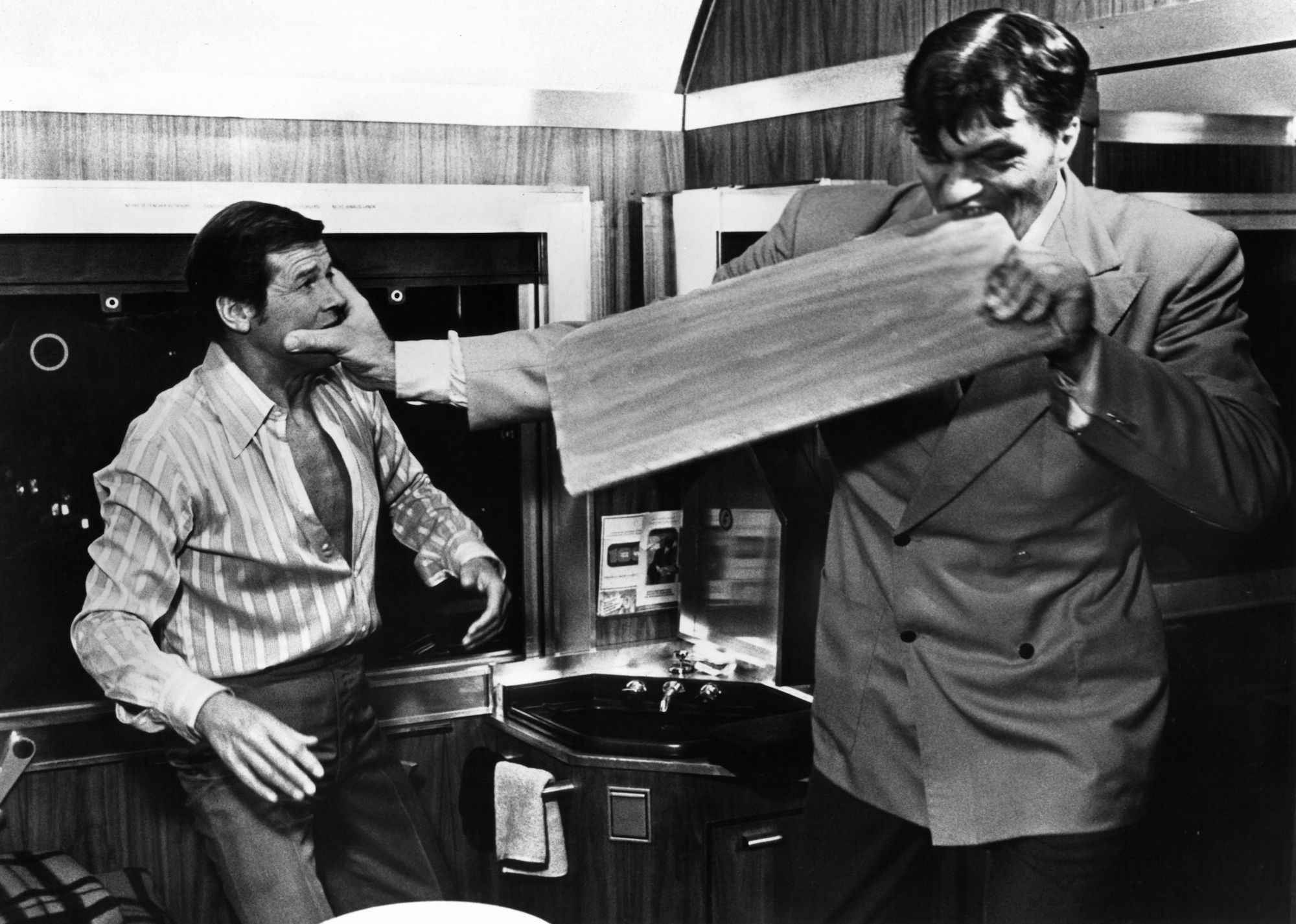 roger moore fights with richard kiel, as jaws, who bites through a board in a scene from the film 'the spy who loved me', 1977 photo by united artistgetty images