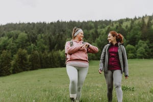 two women hiking and feeling excited about it