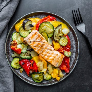 roasted salmon with vegetables a plate of food