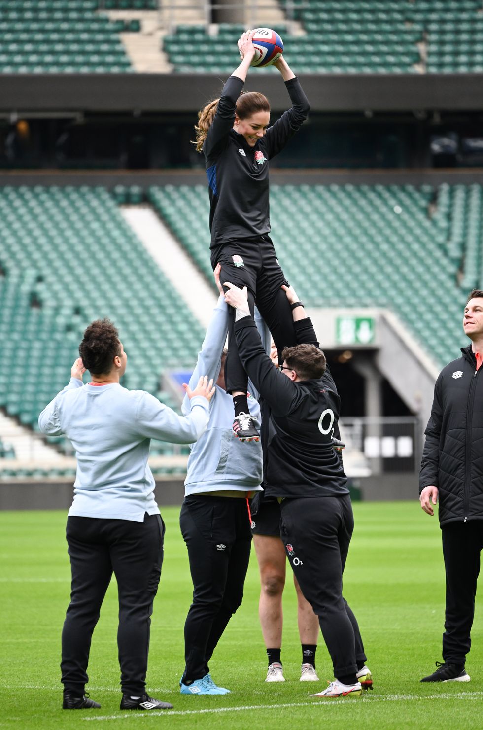 kate middleton plays rugby on field