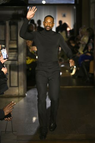 new york, new york   february 14 designer laquan smith appears on the runway during laquan smith   february 2022 new york fashion week at 60 pine street on february 14, 2022 in new york city photo by fernanda calfatgetty images