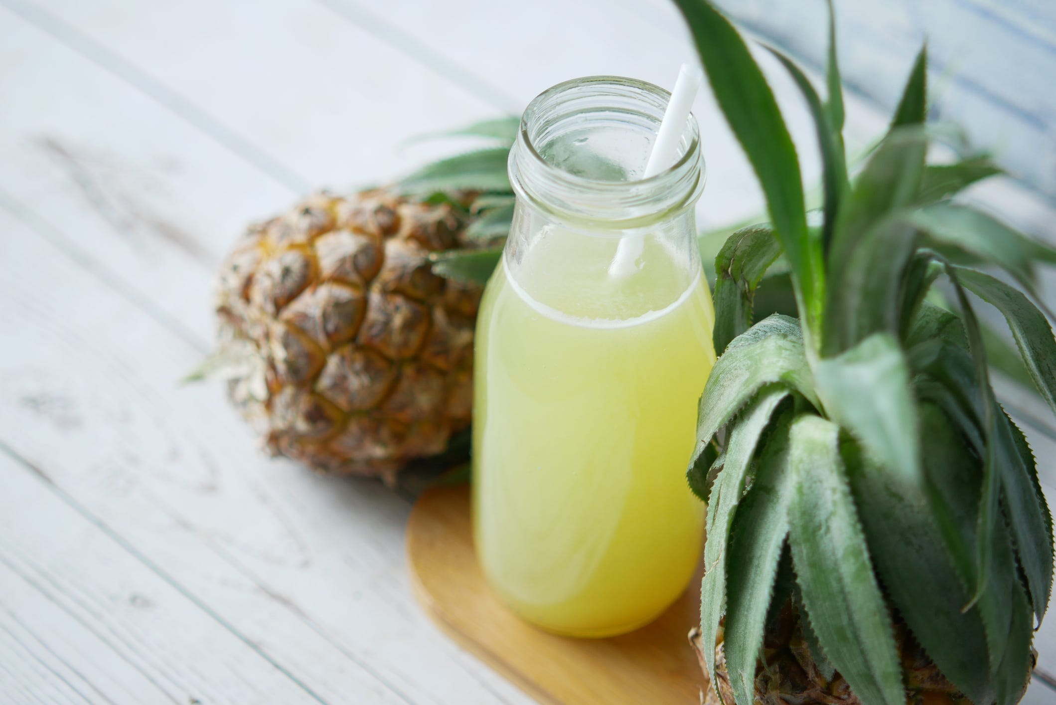 pineapple juice in a bottle on table