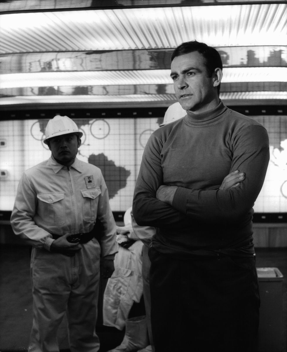sean connery  with his arm folded wearing a turtle neck shirt in a scene from the film 'you only live twice', 1967 photo by united artistsgetty images