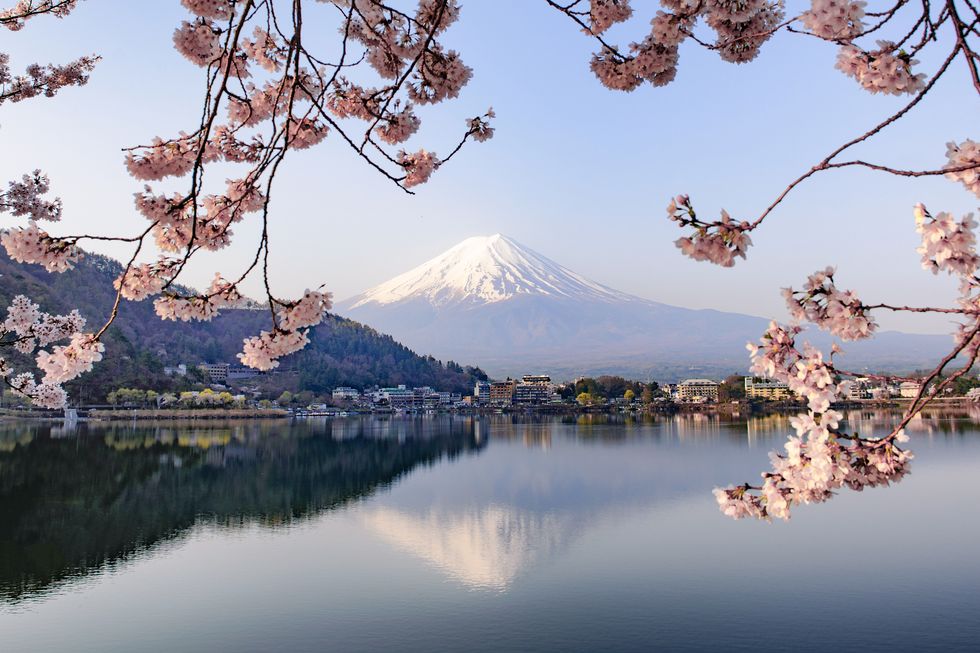 Mount Fuji with a mountain in the background