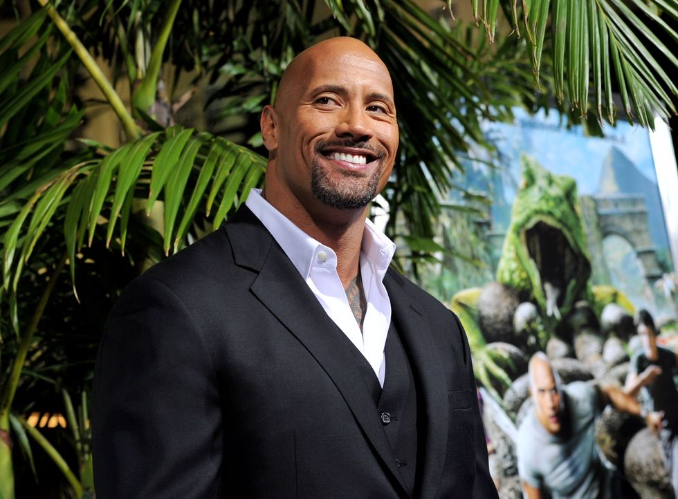 los angeles, ca   february 02  actor dwayne johnson arrives at the premiere of warner bros pictures journey 2 the mysterious island at the chinese theater on february 2, 2012 in los angeles, california  photo by kevin wintergetty images