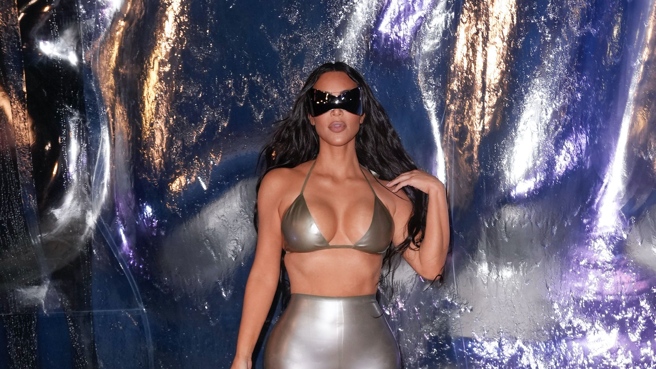 Kim Kardashian Wore a Silver Bikini Top & Leggings to SKIMS Event
