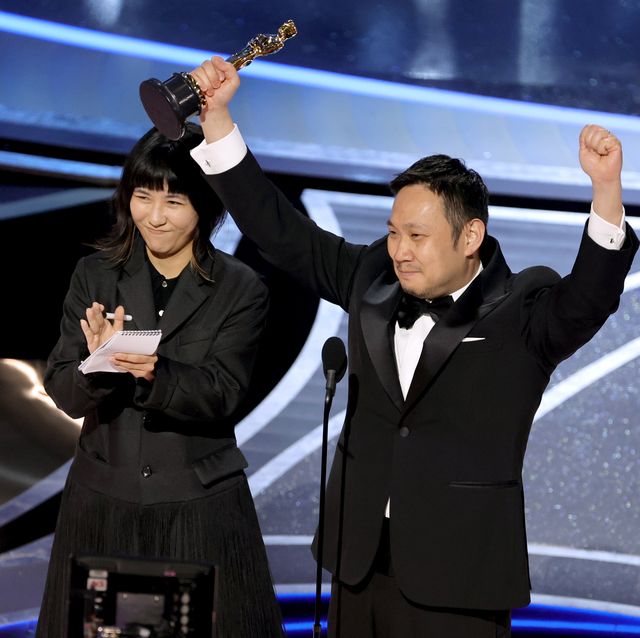 hollywood, california   march 27 ryusuke hamaguchi r accepts the international feature film award for ‘drive my car’ onstage during the 94th annual academy awards at dolby theatre on march 27, 2022 in hollywood, california photo by neilson barnardgetty images