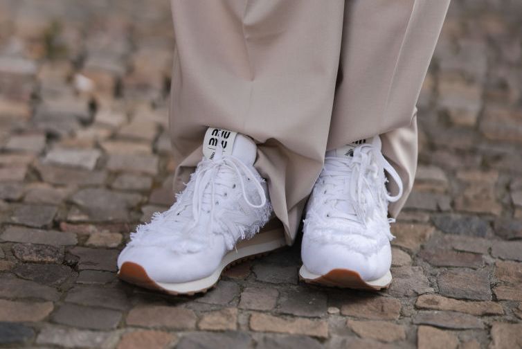 berlin, germany april 01 sonia lyson is seen wearing the frankie shop beige wide pants and new balance x miu miu 574 denim white sneaker on april 01, 2022 in berlin, germany photo by jeremy moellergetty images