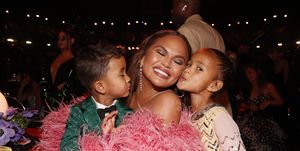 las vegas, nevada   april 03 l r miles stephens, chrissy teigen, and luna stephens attend the 64th annual grammy awards at mgm grand garden arena on april 03, 2022 in las vegas, nevada photo by johnny nunezgetty images for the recording academy