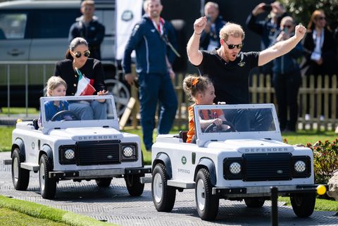 the hague, netherlands   april 16 prince harry, duke of sussex and meghan, duchess of sussex are driven in mini land rovers as they attend the invictus games 2020 the land rover challenge at zuiderpark on april 16, 2022 in the hague, netherlands  photo by samir husseinwireimage
