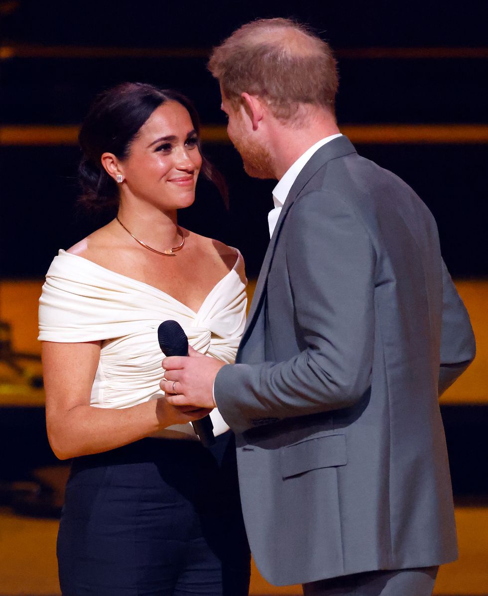the hague, netherlands april 16 embargoed for publication in uk newspapers until 24 hours after create date and time meghan, duchess of sussex and prince harry, duke of sussex on stage during the opening ceremony of the invictus games 2020 at zuiderpark on april 16, 2022 in the hague, netherlands photo by max mumbyindigogetty images