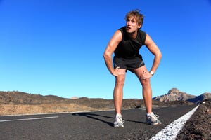 jogger resting after running man runner taking a break during training outdoors in amazing landscape young caucasian male fitness model after work out click for more