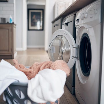 Shot of a laundry basket filled with freshly dried clothes fresh and unfolded