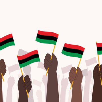 group of hands waving pan african flag afro american flag