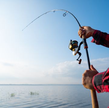 closeup man fishing in the lake