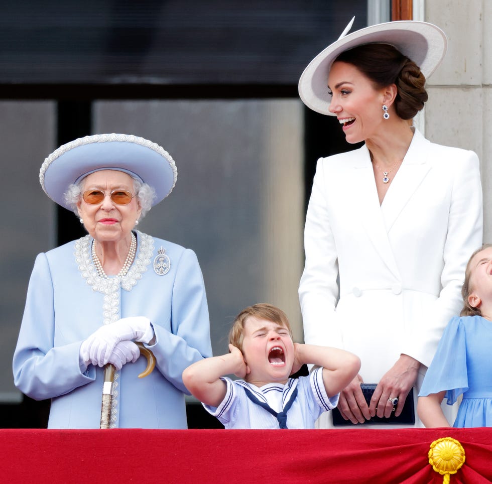 london, united kingdom june 02: (embargoed for publication in uk newspapers until 24 hours after create date and time) queen elizabeth ii, prince louis of cambridge and catherine, duchess of cambridge watch a flypast from the balcony of buckingham palace during trooping the colour on june 2, 2022 in london, england. trooping the colour, also known as the queens birthday parade, is a military ceremony performed by regiments of the british army that has taken place since the mid 17th century. it marks the official birthday of the british sovereign. this year, from june 2 to june 5, 2022, there is the added celebration of the platinum jubilee of elizabeth ii in the uk and commonwealth to mark the 70th anniversary of her accession to the throne on 6 february 1952. (photo by max mumby/indigo/getty images)