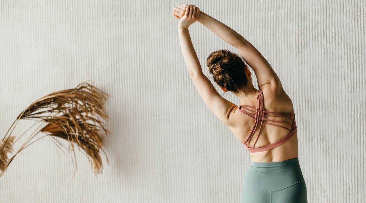 10 Very Simple Exercises to Eliminate Back Rolls for Good, According to Expert Trainers