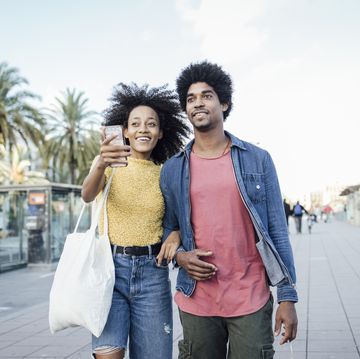 young african american couple on vacation exploring