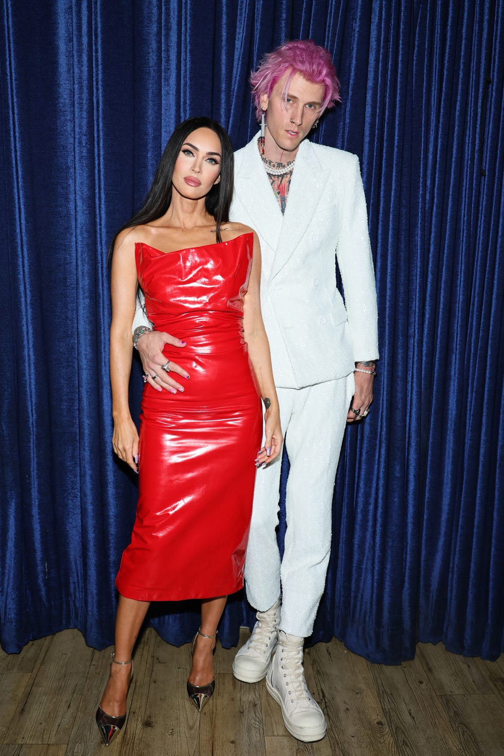 Megan Fox sizzles in red suit and bra with Machine Gun Kelly