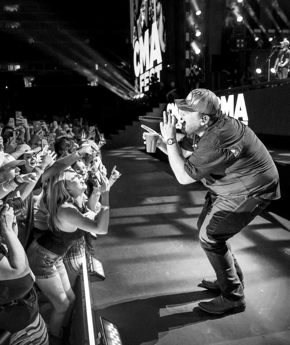 nashville, tennessee june 11 editors note image has been converted to black white color image is available luke combs performs during day 3 of cma fest 2022 at nissan stadium on june 11, 2022 in nashville, tennessee photo by jason kempingetty images