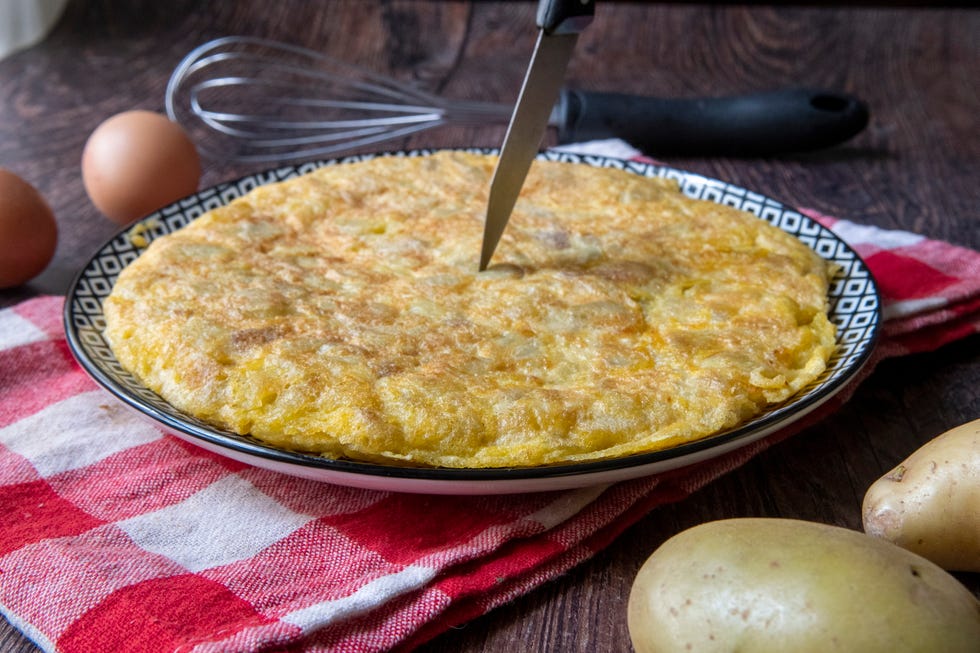 typically spanish food, it is a mixture of beaten egg and fried potatoes. onion can be added.