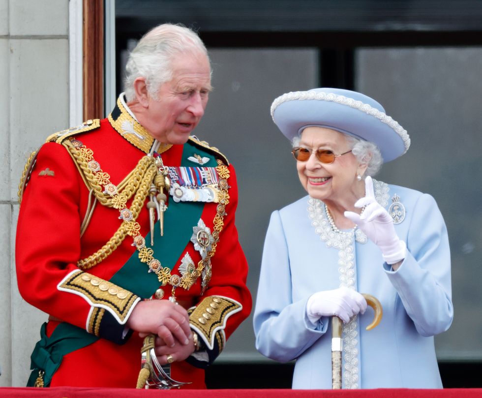 london, united kingdom june 02 embargoed for publication in uk newspapers until 24 hours after create date and time prince charles, prince of wales wearing the uniform of colonel of the welsh guards and queen elizabeth ii watch a flypast from the balcony of buckingham palace during trooping the colour on june 2, 2022 in london, england trooping the colour, also known as the queens birthday parade, is a military ceremony performed by regiments of the british army that has taken place since the mid 17th century it marks the official birthday of the british sovereign this year, from june 2 to june 5, 2022, there is the added celebration of the platinum jubilee of elizabeth ii in the uk and commonwealth to mark the 70th anniversary of her accession to the throne on 6 february 1952 photo by max mumbyindigogetty images