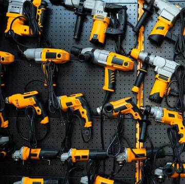 many electric drills on the shelf