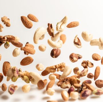 different nuts falling, walnut almonds hazelnuts pistachios cashews