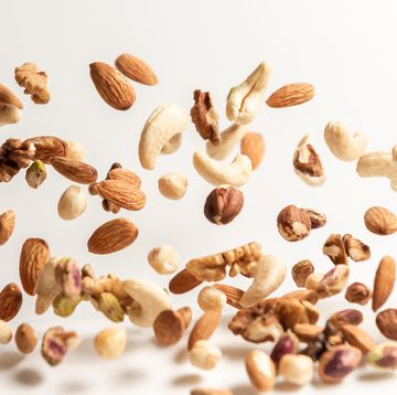 different nuts falling, walnut almonds hazelnuts pistachios cashews