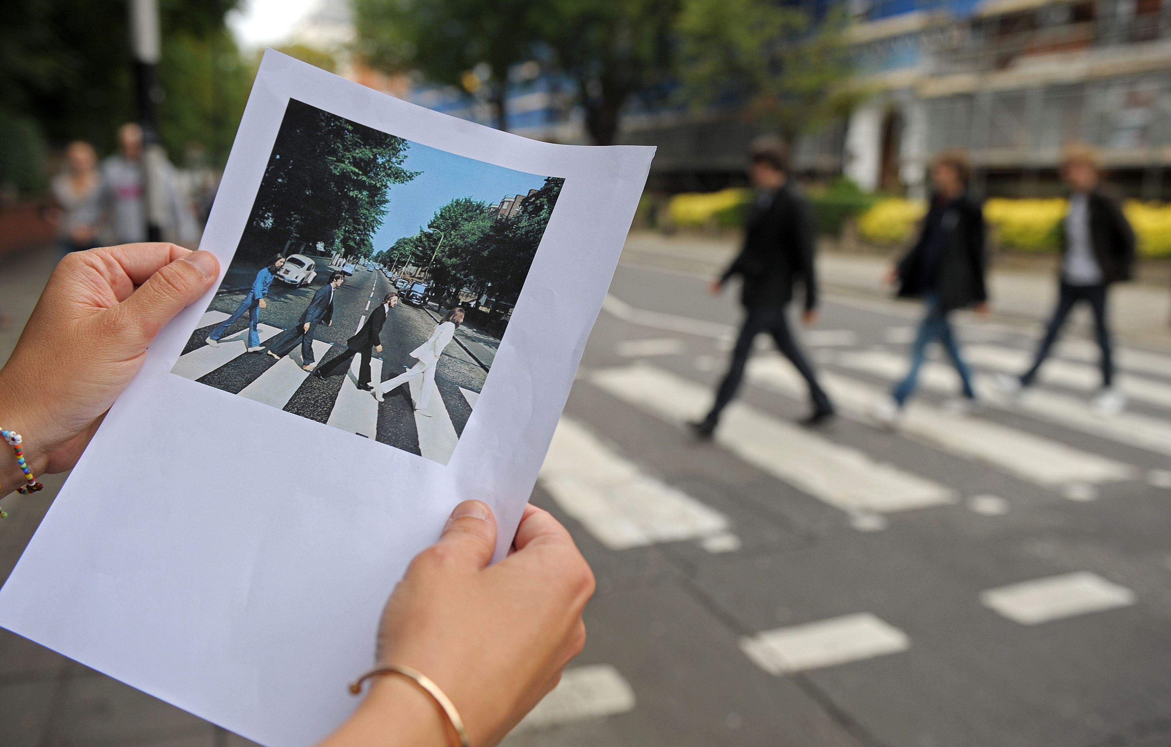 Where are the Abbey Road Studios, what year was the famous Beatles album  cover shot and who else has recorded music there?