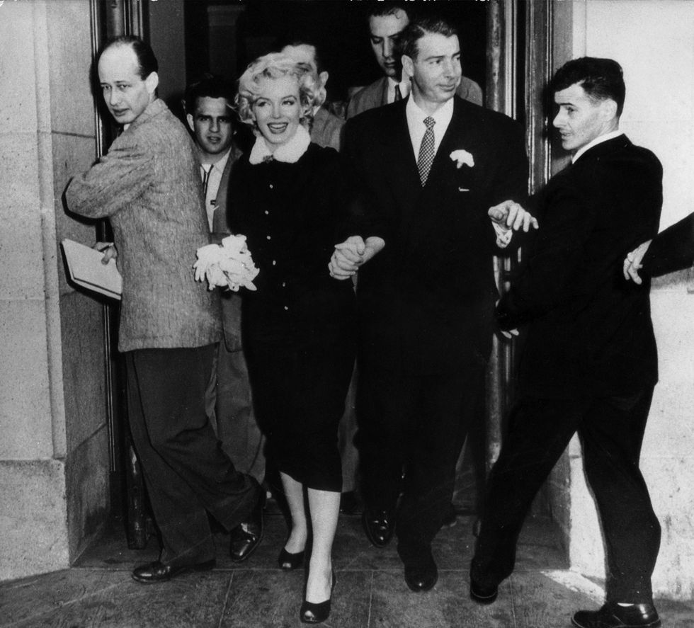 Marilyn Monroe and Joe DiMaggio leaving the town hall after their wedding on January 14, 1954, in San Francisco, California