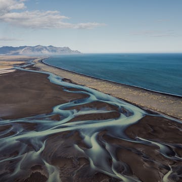 a beach with sand and water