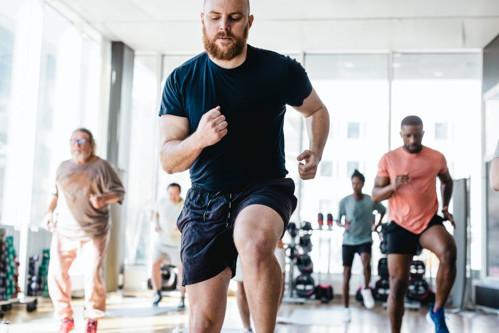 a man running in a gym