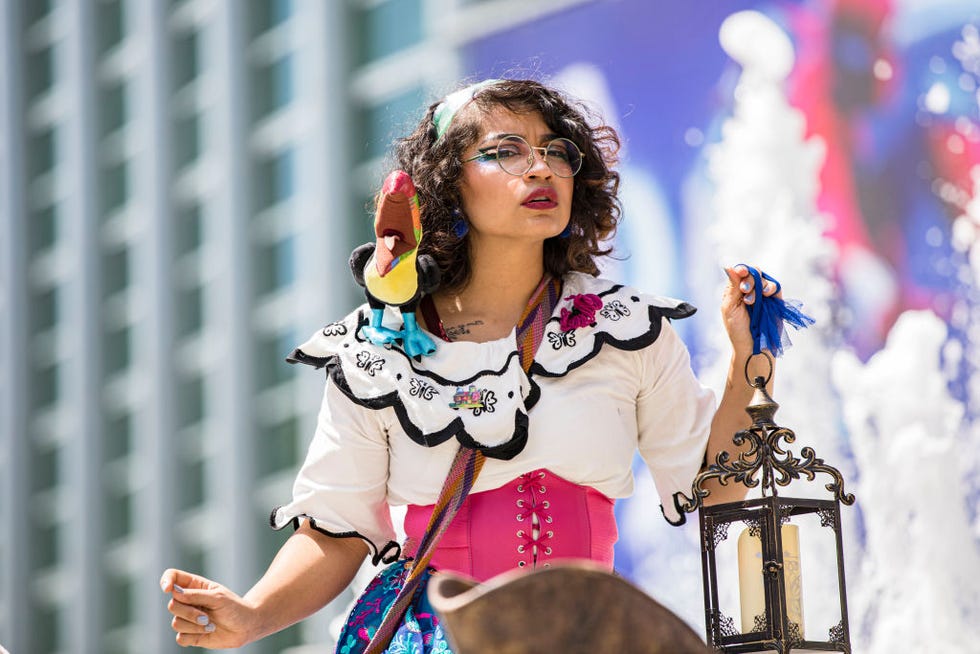 a cosplayer dressed as mirabel madrigal