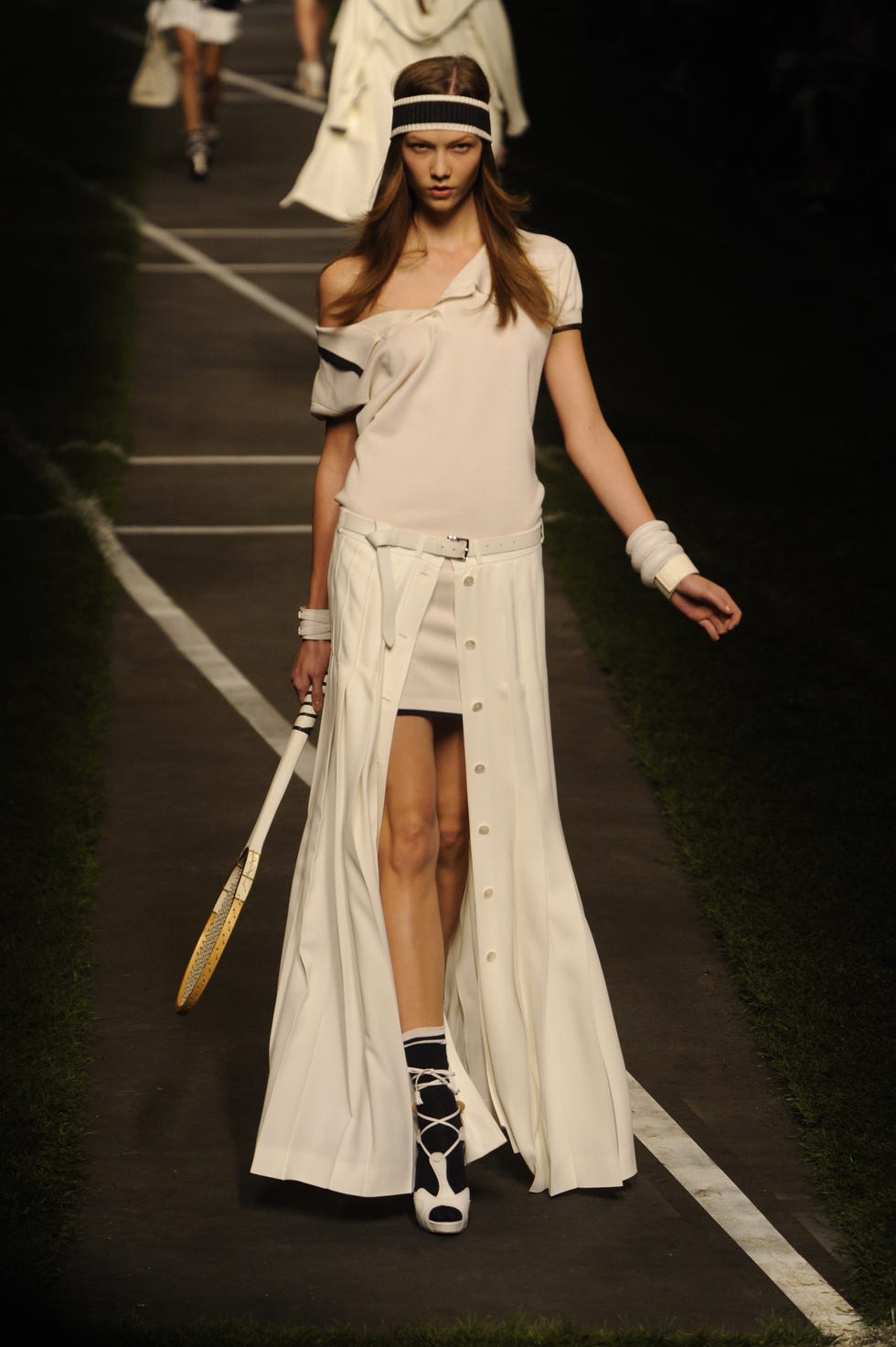 a model on the runway at hermes spring 2010 show at halle freyssinet designed by jean paul gaultier photo by giovanni giannoniwwdpenske media via getty images